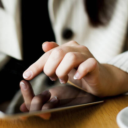 Hand holding digital tablet